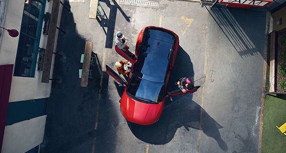 Top view of red veloster with open the door