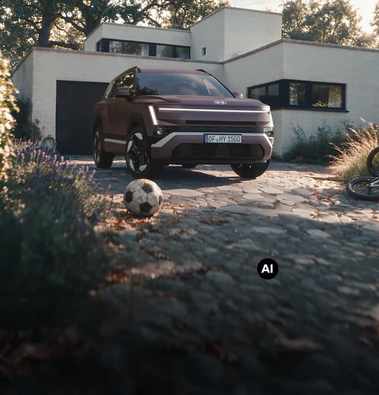 Hyundai TUCSON parked in a driveway with a residential home in the background.