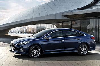 Sonata Parked in font of a fancy building