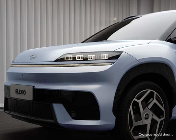 Front view of the Hyundai ELEXIO electric SUV, featuring a sleek aerodynamic design, signature LED headlights, and modern styling that highlights Hyundai’s innovative EV technology.