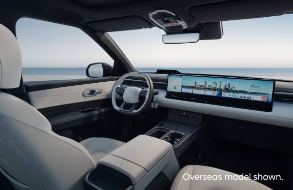 Hyundai Elexio front and rear seat design with light leather trim, panoramic sunroof, and foldable armrest crafted for comfort and modern elegance