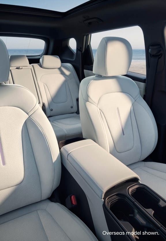 Hyundai Elexio front and rear seat design with light leather trim, panoramic sunroof, and foldable armrest crafted for comfort and modern elegance