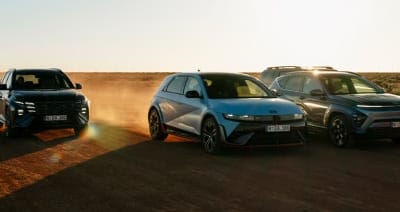 Hyundai TUCSON Hybrid, IONIQ 5 N, and KONA Hybrid charge side by side across a desert trail at sunset—showcasing electrified performance, bold design, and dynamic capability in a dramatic off-road setting. Would you like alternate versions tailored for lu