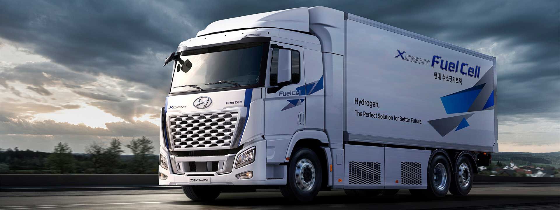 White Hyundai XCIENT Fuel Cell truck on road