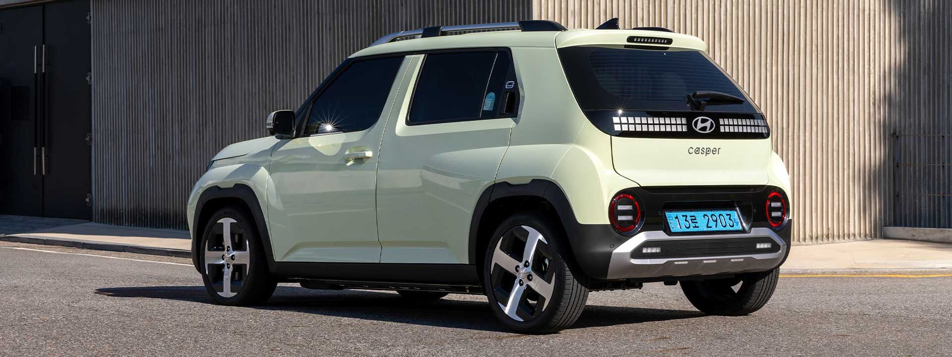 Rear view of the 2026 Hyundai Palisade Hybrid SUV parked on a desert road
