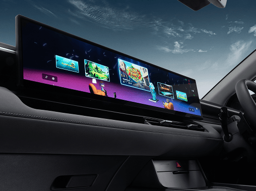 Close-up of the ultra-wide, panoramic touchscreen infotainment display inside the Hyundai ELEXIO, showing a vibrant user interface with multiple apps against a dark leather dashboard.
