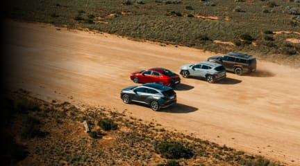 Four hyundai cars on a rugged terrain