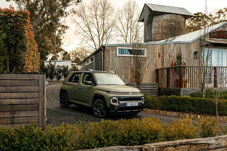 Explore the Hyundai INSTER in khaki green, featuring a rugged SUV-inspired exterior, signature LED lighting and a compact design built for modern urban driving.