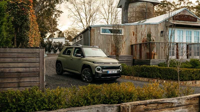 Explore the Hyundai INSTER in khaki green, featuring a rugged SUV-inspired exterior, signature LED lighting and a compact design built for modern urban driving.
