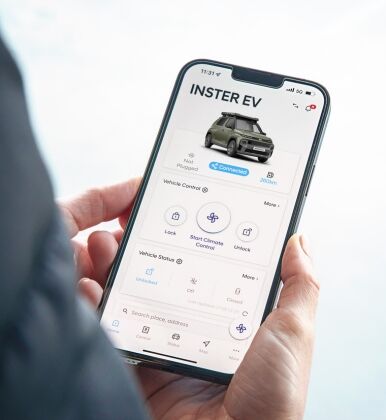 Person viewing Inster EV Bluelink Mobile App on a mobile phone