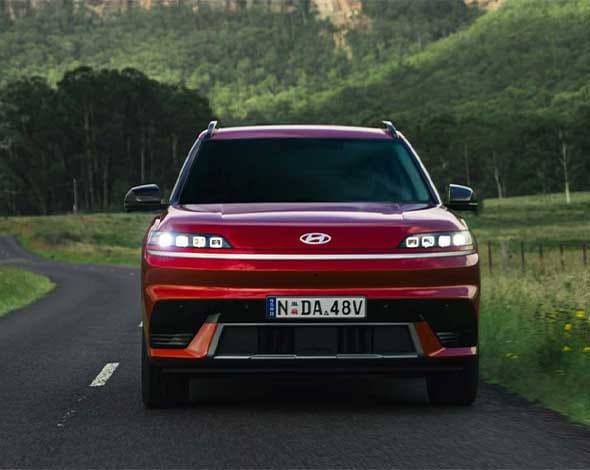 Hyundai ELEXIO in Red with a scenic backdrop