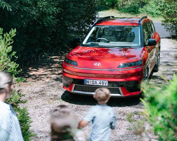 Hyundai ELEXIO in Red with a scenic backdrop
