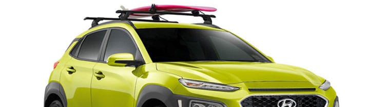 Kona_Accessories_Front34_ThroughRacks-Surfboard-748x210.jpg
