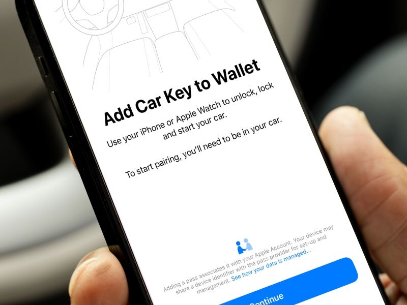 A smartphone screen displays instructions for adding the digital key to Apple Wallet, enabling users to unlock, lock, and start their car with their iPhone or Apple Watch.