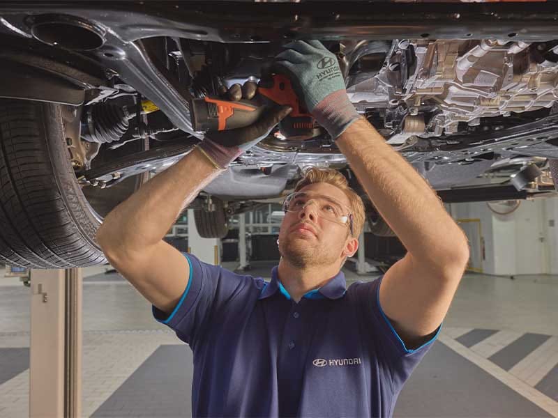 Hyundai technician servicing the car