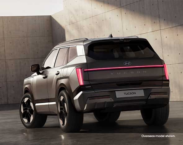 Hyundai TUCSON rear exterior featuring signature LED lighting, sculpted body lines, and a confident SUV stance that blends modern design with everyday practicality.