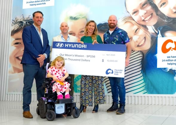 Hyundai Help for Kids presents a $10,000 donation to Our Moon's Mission, supporting children with special needs—capturing a heartfelt moment of community impact and inclusive care.