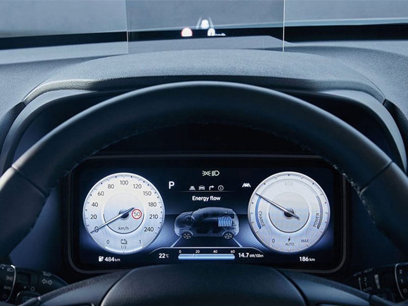 Digital dashboard of a vehicle displaying driving speed, energy flow, range (484 km), and efficiency metrics—highlighting advanced interface and  performance at 14.7 kWh/100 km.