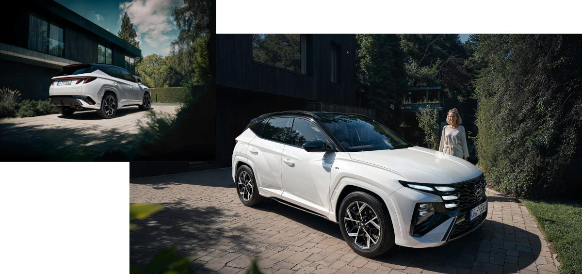 Una mujer camina detrás del Hyundai TUCSON.