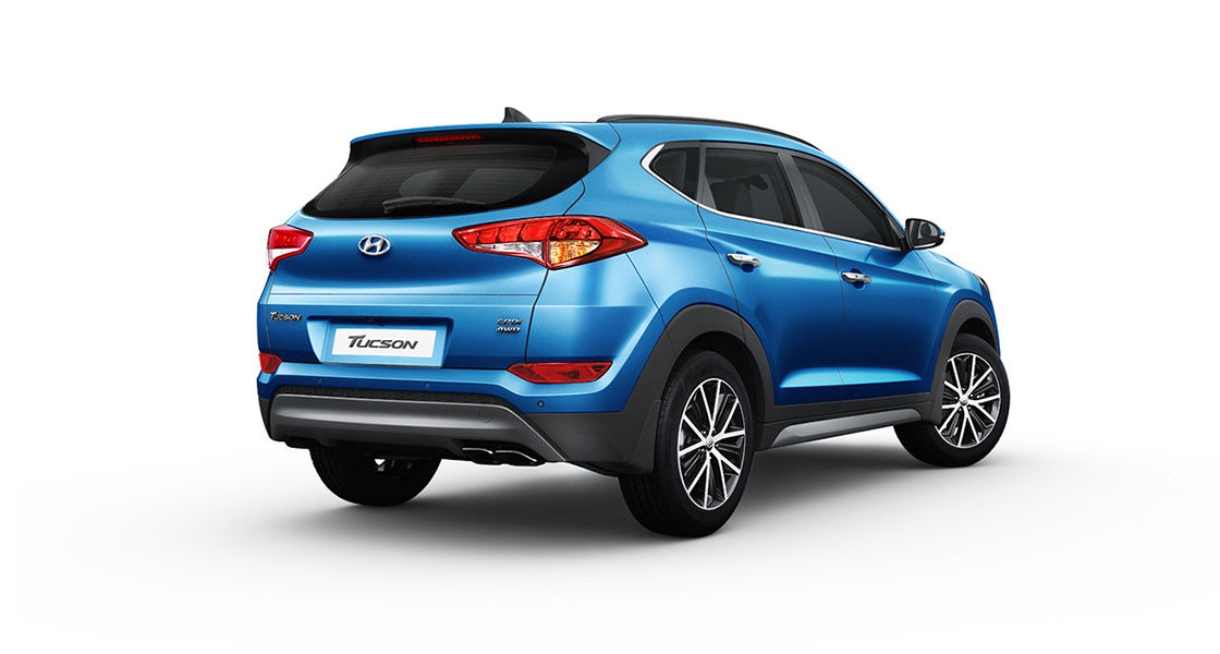 Side rear view of blue Tucson