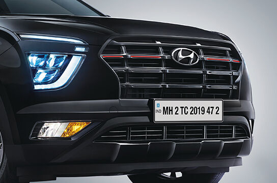 Black gloss radiator grille with red insert