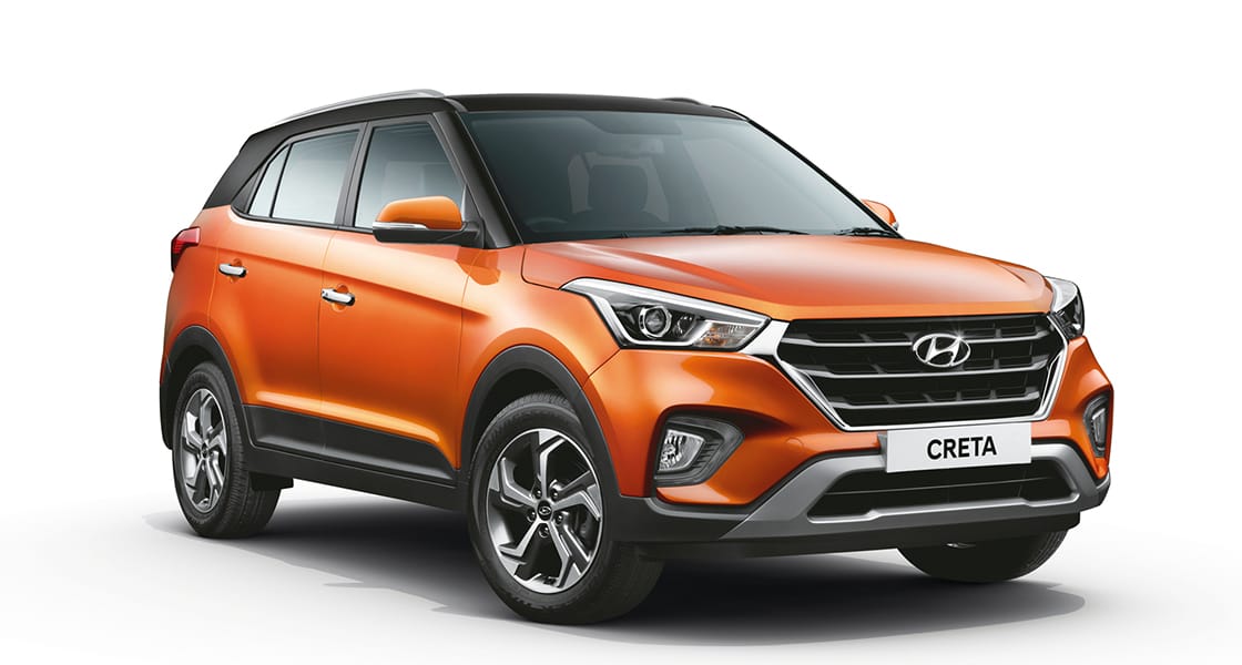 Side rear view of silver Elantra driving on the road in the city