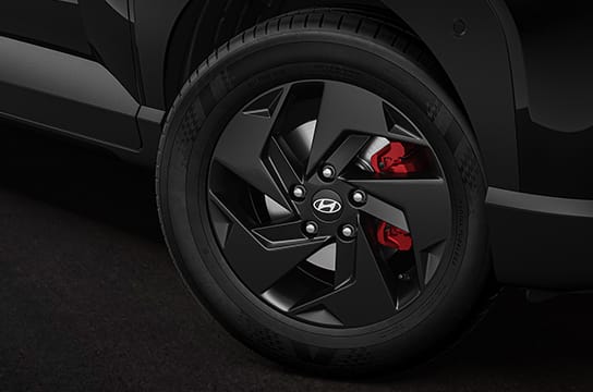 black painted alloys with red brake calipers