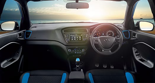 Front view of driving blue Elantra on the road in the city