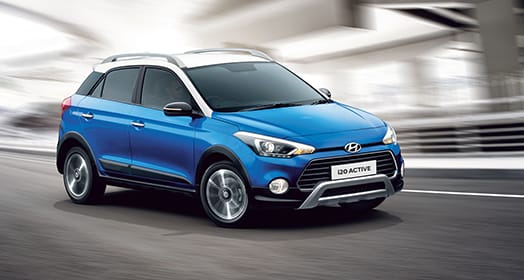 Side rear view of silver Elantra driving on the road in the city