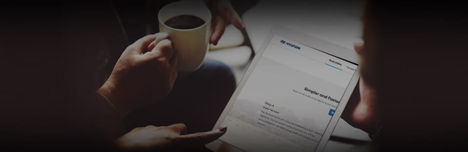 Closer view of hands polishing a clay model.