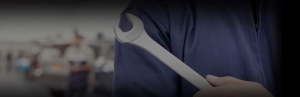 A car is driving on the bridge of sea.