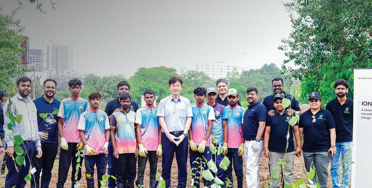 Volunteers planting saplings at a Hyundai community drive