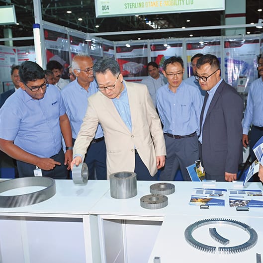 Engineers reviewing a body panel on the supplier line