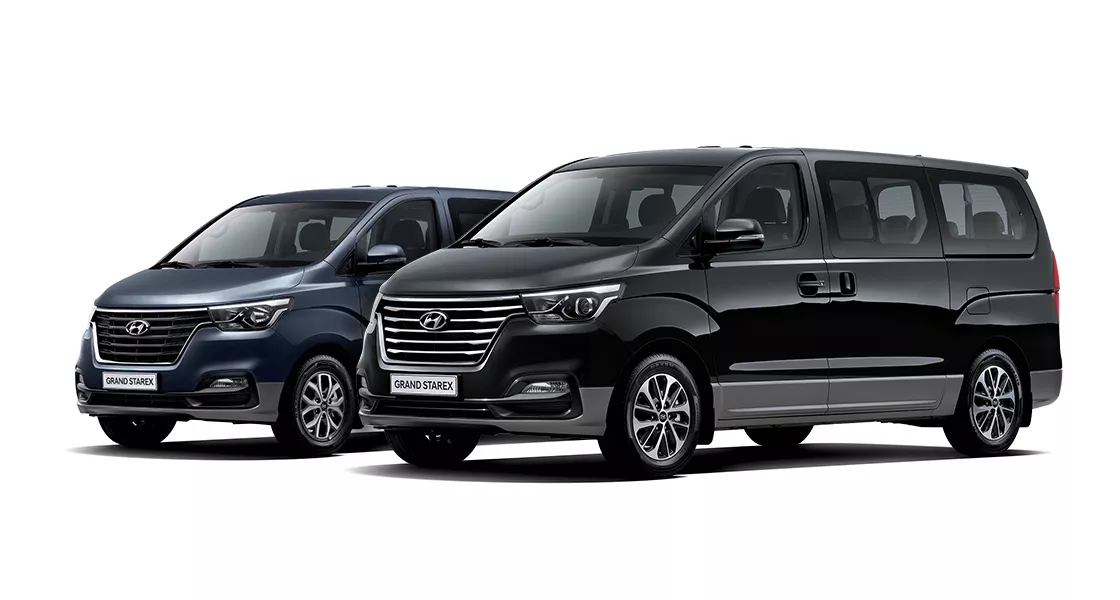 GRAND STAREX Urban left - 9-seater Premium Special (MoonLight Cloud), right - 9-seater Exclusive (Timeless Black)