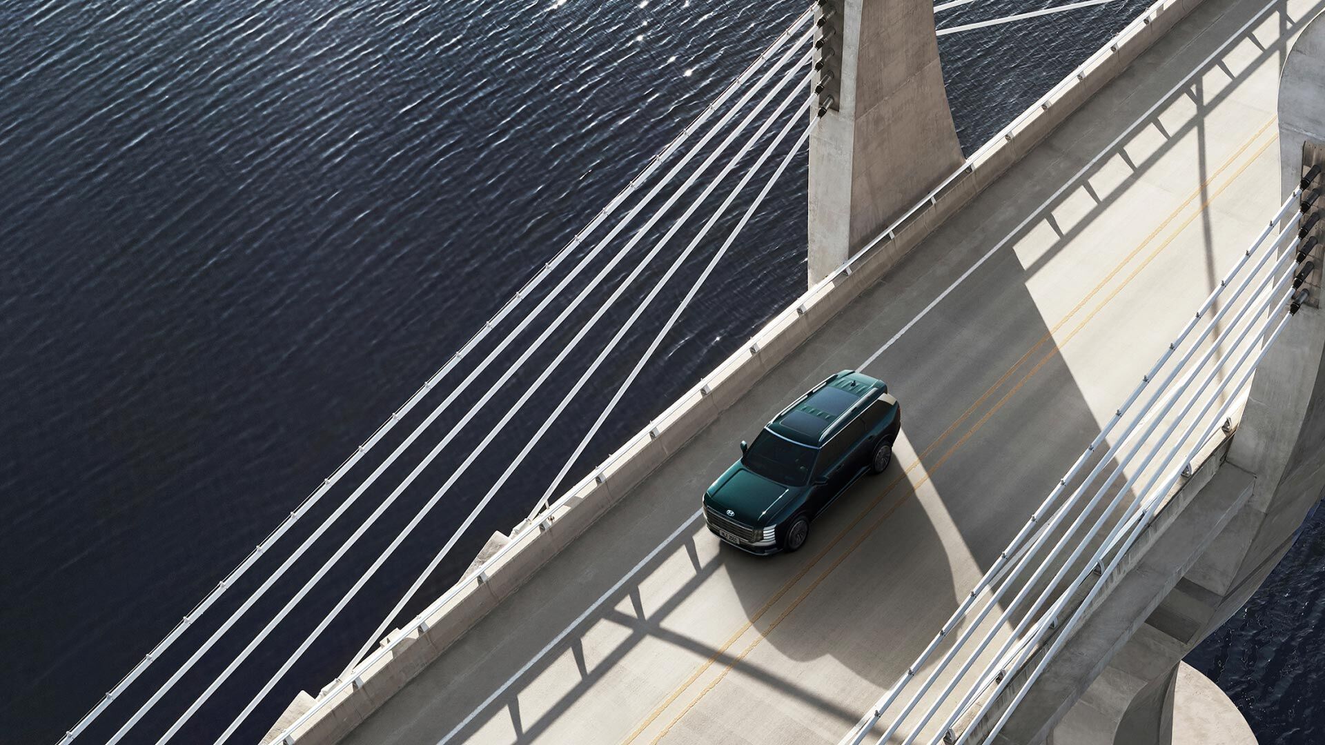 Bird's eye view of the all-new PALISADE, driving on the road