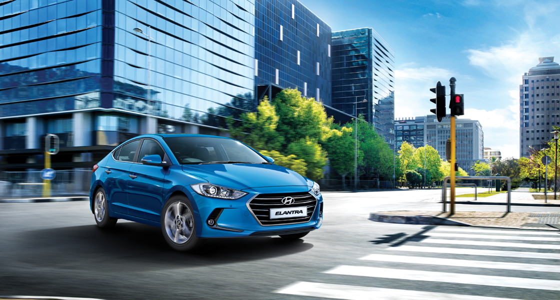 Front view od blue Elantra driving on the road