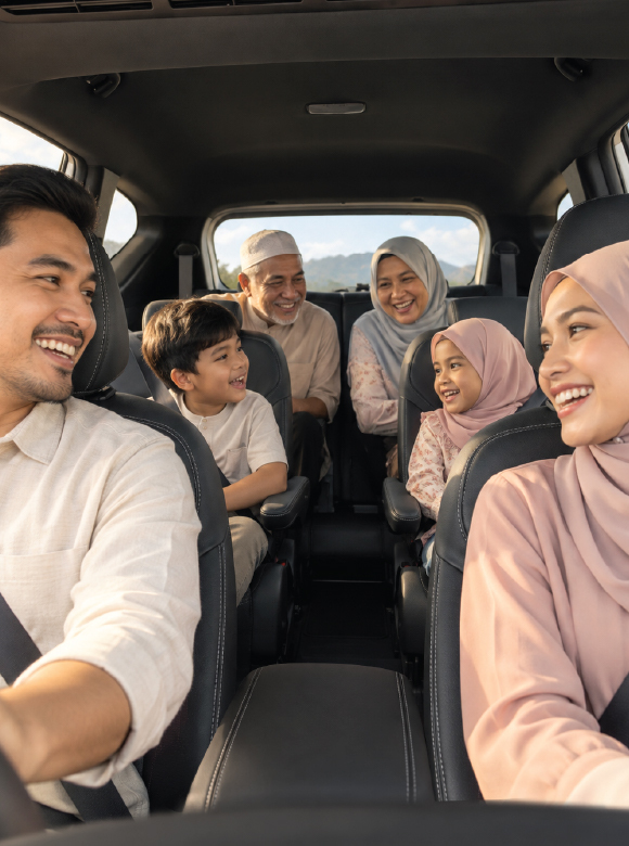 A smiling Malaysian family of six seated together inside the Hyundai Stargazer cabin