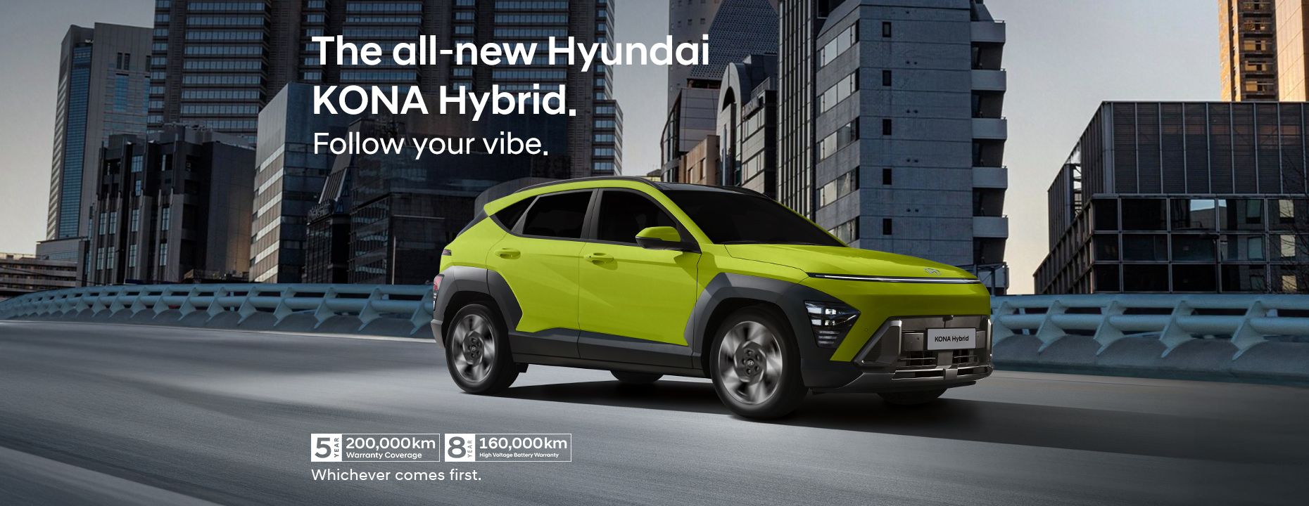 Running shot of the all-new KONA Hybrid on a bridge