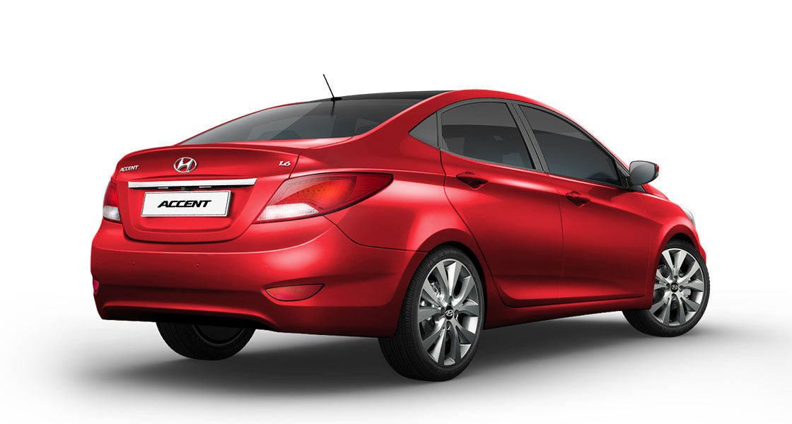 Right side rear view of red Accent
