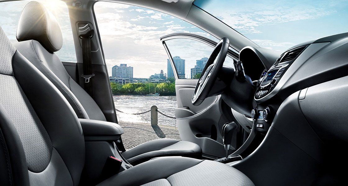 City view from front passenger's seat through the driver's door on a clear day