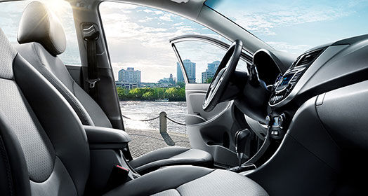 City view from front passenger's seat through the driver's door on a clear day