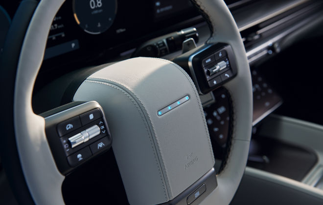 The steering wheel's four pixel lights illuminate.