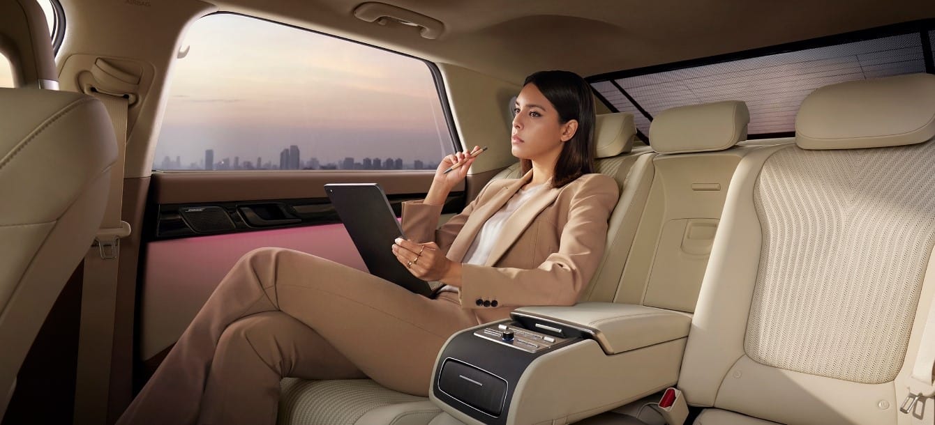 A woman is working on a laptop in the AZERA.