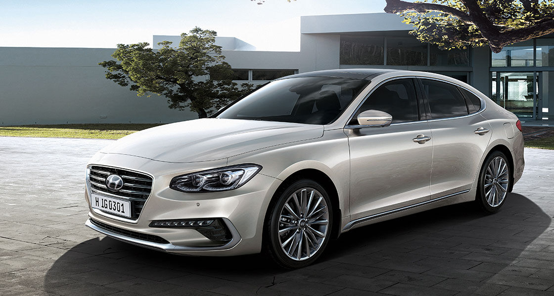 Left side view of beige Azera