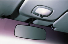 image of county rear view mirror and overhead lamp