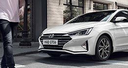 elantra 2019 with man walking on sidewalk