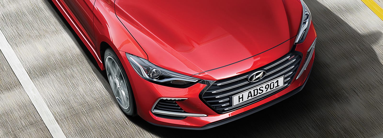 Top view of front part of blue Elantra parked outdoor