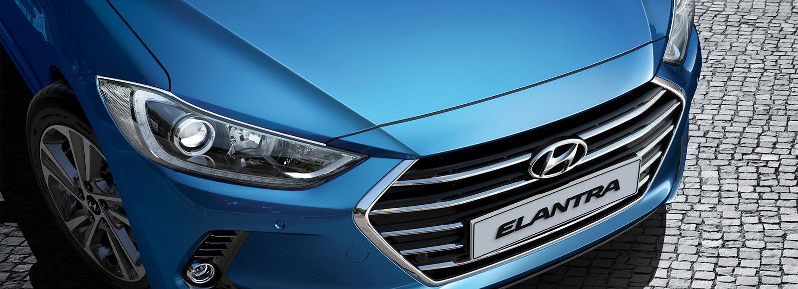 Top view of front part of blue Elantra parked outdoor
