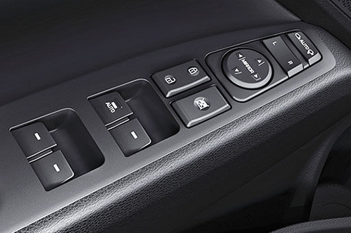 Power window control buttons on the armrest area