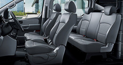 Five dark gray seats inside H-1
